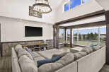 Step into luxury with this stunning living room, boasting a spacious sectional sofa and a cozy atmosphere.