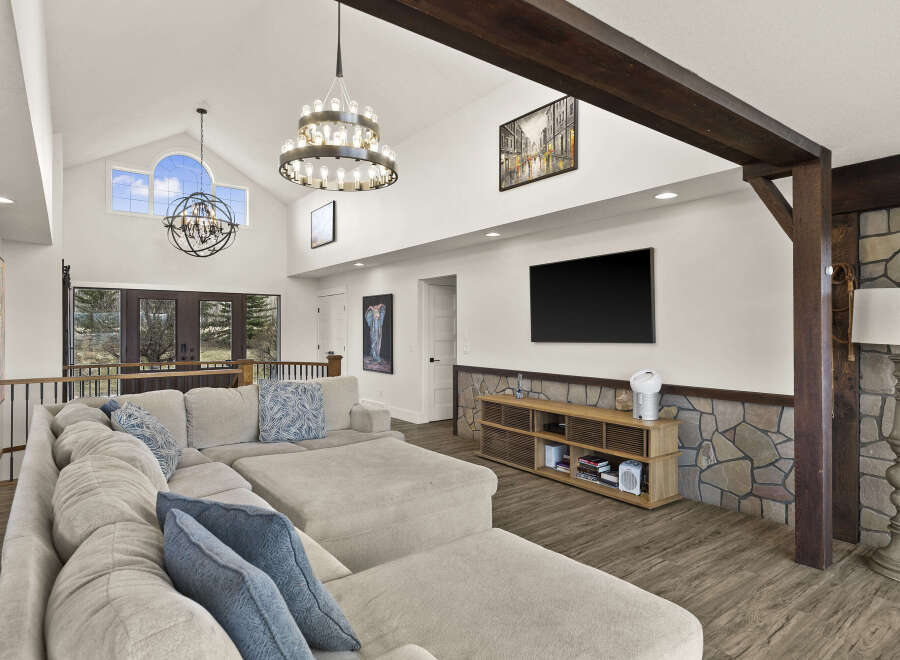 Step into luxury with this stunning living room, boasting a spacious layout and high ceilings.