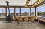 This stunning dining area features a unique live-edge wooden table, perfect for gatherings.