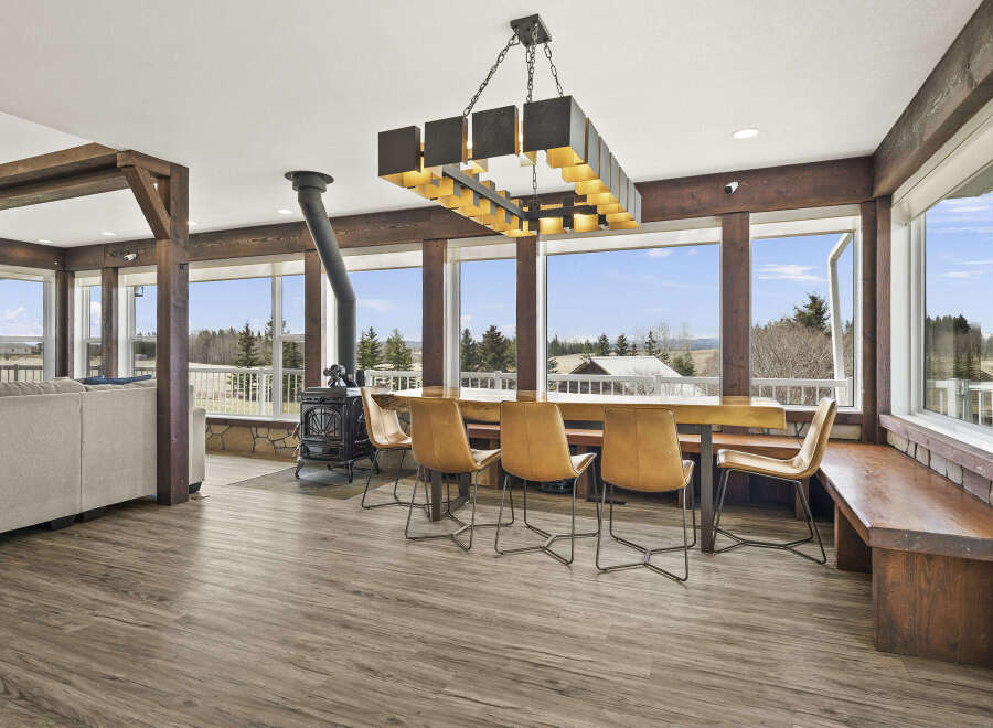 This stunning property boasts a spacious dining area with a rustic charm, perfect for entertaining.