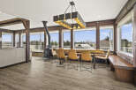 This stunning property boasts a spacious dining area with a rustic charm, perfect for entertaining.