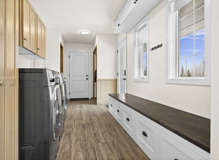 This stunning laundry room boasts modern design and functionality.