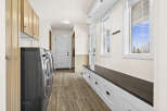 This stunning laundry room boasts modern design and functionality.