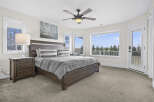This stunning bedroom offers a serene retreat with its spacious layout and abundant natural light.