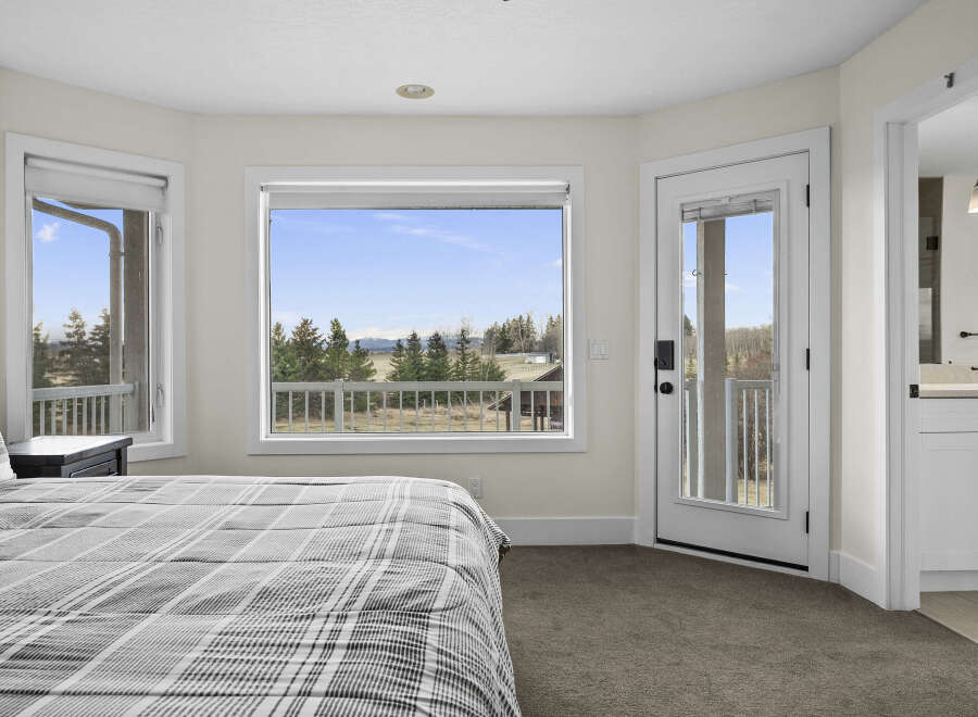 This stunning bedroom offers breathtaking views and a serene atmosphere.
