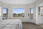 This stunning bedroom offers breathtaking views and a serene atmosphere.