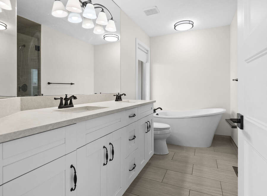 This stunning bathroom features a modern design with a luxurious freestanding tub, perfect for relaxation.
