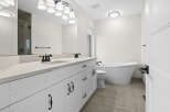 This stunning bathroom features a modern design with a luxurious freestanding tub, perfect for relaxation.