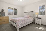 This charming bedroom features a cozy bed with a whimsical unicorn-themed comforter, perfect for a child's space.