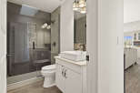 Step into luxury with this beautifully designed bathroom! Featuring a sleek, modern vanity with a vessel sink, and a spacious glass-enclosed shower, this space is both stylish and functional.