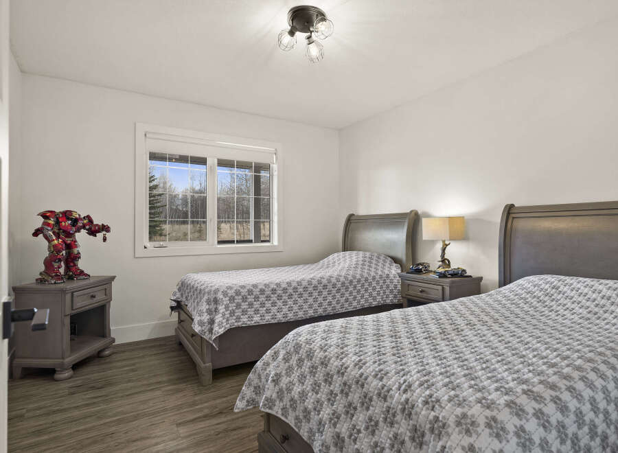 This inviting bedroom features two twin beds, perfect for guests or children.