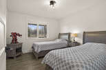 This inviting bedroom features two twin beds, perfect for guests or children.