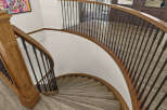 This stunning property boasts a beautifully crafted spiral staircase, a true architectural highlight.
