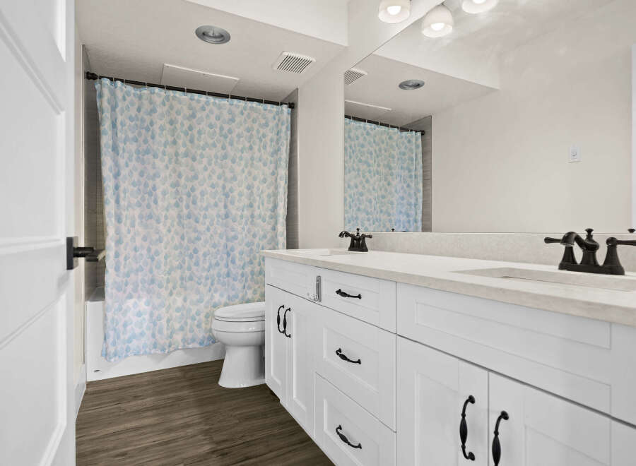 This stunning bathroom features a modern design with a bright and airy feel.