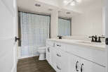 This stunning bathroom features a modern design with a bright and airy feel.