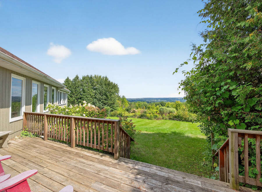 Enjoy breathtaking views from this stunning property! This home features a spacious deck, perfect for outdoor entertaining and relaxation.