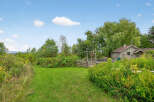 Discover a charming property nestled in a serene natural setting.