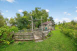 Discover a charming property with a rustic garden and a cozy shed, perfect for those seeking a tranquil retreat.