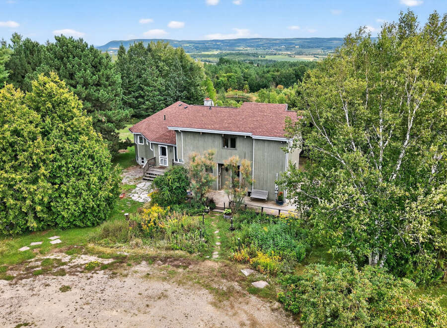 Nestled amidst lush greenery, this stunning property offers a serene escape with breathtaking views.