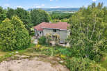 Nestled amidst lush greenery, this stunning property offers a serene escape with breathtaking views.