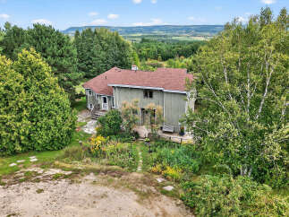 Nestled amidst lush greenery, this stunning property offers a serene escape with breathtaking views.