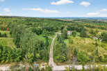 Discover your dream property! This stunning estate boasts a private, tree-lined driveway leading to a beautiful home.