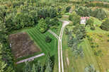 Discover a stunning property nestled in a serene, wooded landscape.