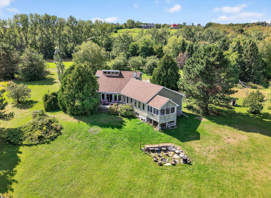This stunning property boasts a spacious, well-maintained lawn, perfect for outdoor activities and relaxation.