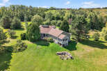 This stunning property boasts a spacious, well-maintained lawn, perfect for outdoor activities and relaxation.