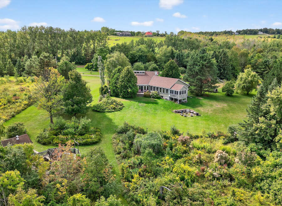 This stunning property boasts a spacious, well-maintained lawn, perfect for outdoor activities and relaxation.