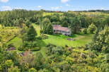 This stunning property boasts a spacious, well-maintained lawn, perfect for outdoor activities and relaxation.
