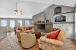 This inviting living space features a cozy seating area with a stylish sofa and armchairs, perfect for relaxation.