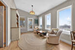Step into this inviting living space, featuring a cozy seating area and a charming, rustic aesthetic.