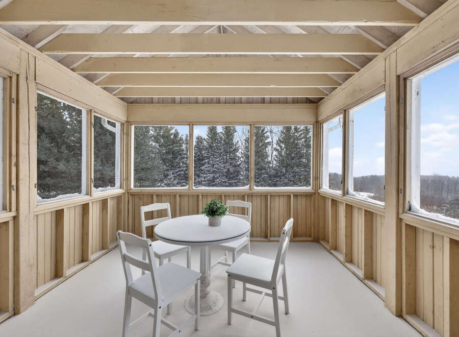 Enjoy the serene beauty of this sunroom, perfect for relaxation and taking in the surrounding views.