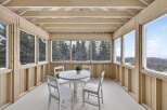 Enjoy the serene beauty of this sunroom, perfect for relaxation and taking in the surrounding views.