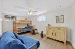 This charming bedroom features a cozy bunk bed, perfect for kids or guests.