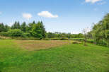 Enjoy outdoor activities in this spacious yard! This property features a volleyball net, perfect for friendly matches and summer fun.