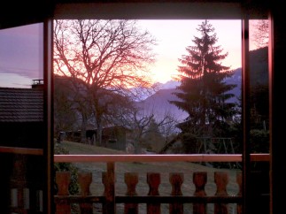 Wake up to breathtaking sunrise views from your private balcony, nestled in a serene mountain setting.