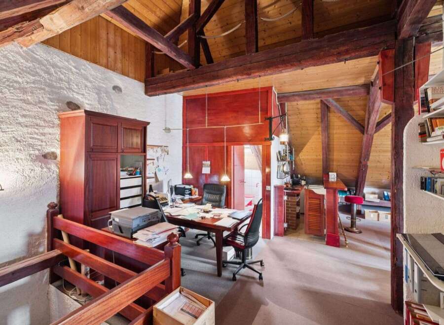 Discover the charm of this unique property, featuring a stunning interior with exposed wooden beams and a rustic aesthetic.