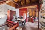 Discover the charm of this unique property, featuring a stunning interior with exposed wooden beams and a rustic aesthetic.