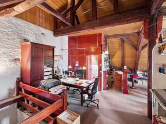 Discover the charm of this unique property, featuring a stunning interior with exposed wooden beams and a rustic aesthetic.