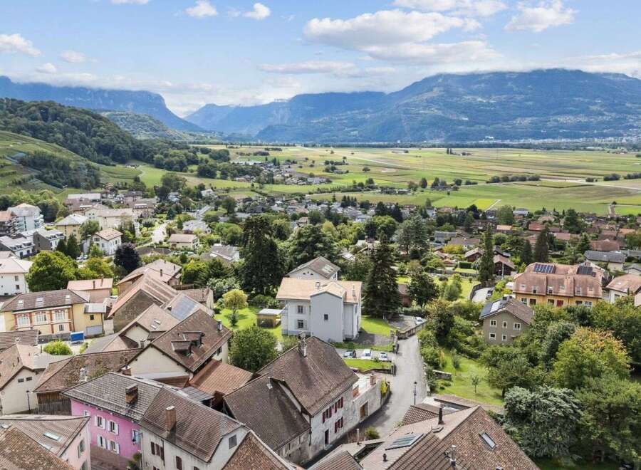 Discover a charming property nestled in a picturesque village, offering stunning views of the surrounding mountains and lush landscapes.