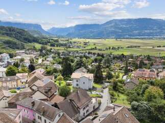Discover a charming property nestled in a picturesque village, offering stunning views of the surrounding mountains and lush landscapes.