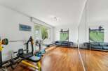This stunning property boasts a dedicated home gym, perfect for fitness enthusiasts.