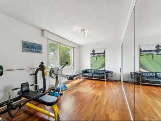 This stunning property boasts a dedicated home gym, perfect for fitness enthusiasts.