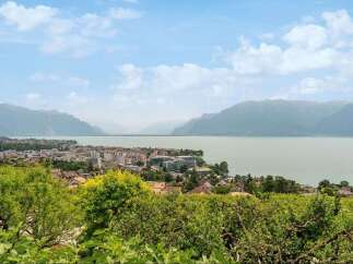 Enjoy breathtaking views of the lake and mountains from this stunning property.