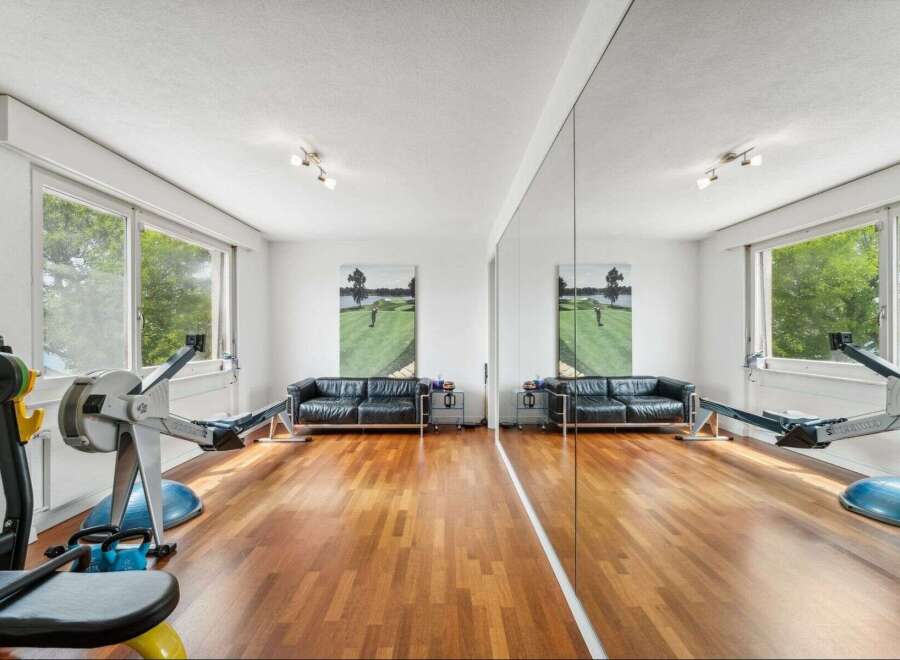 This stunning property boasts a dedicated home gym, perfect for maintaining a healthy lifestyle.