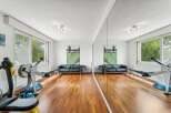 This stunning property boasts a dedicated home gym, perfect for maintaining a healthy lifestyle.