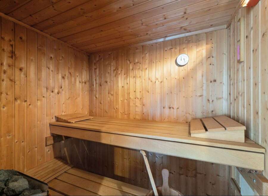 Step into relaxation with this inviting sauna.