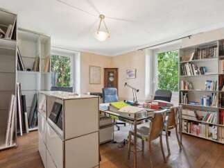 This stunning office space boasts a bright and airy atmosphere, perfect for productivity.